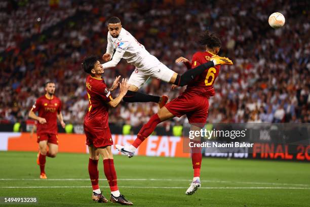 Yousseff En-Nesyri of Sevilla FC heads the ball from Alex Telles and Chris Smalling of AS Roma during the UEFA Europa League 2022/23 final match...