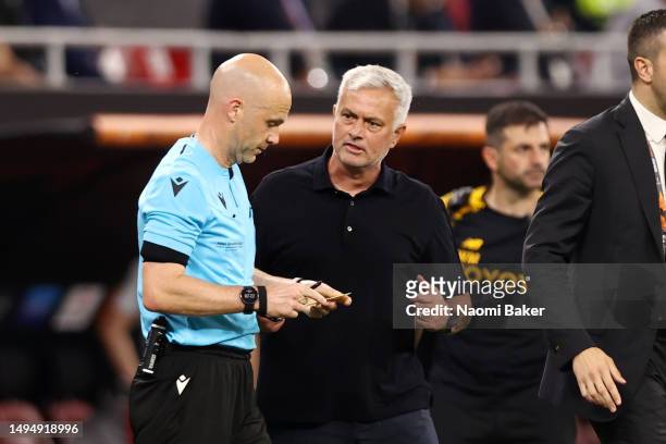 Referee Anthony Taylor looks on with Jose Mourinho, Head Coach of AS Roma, during the UEFA Europa League 2022/23 final match between Sevilla FC and...