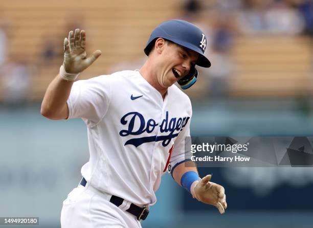 Will Smith of the Los Angeles Dodgers reacts to his two run homerun as he runs the bases, to take a 3-0 lead over the Washington Nationals, during...