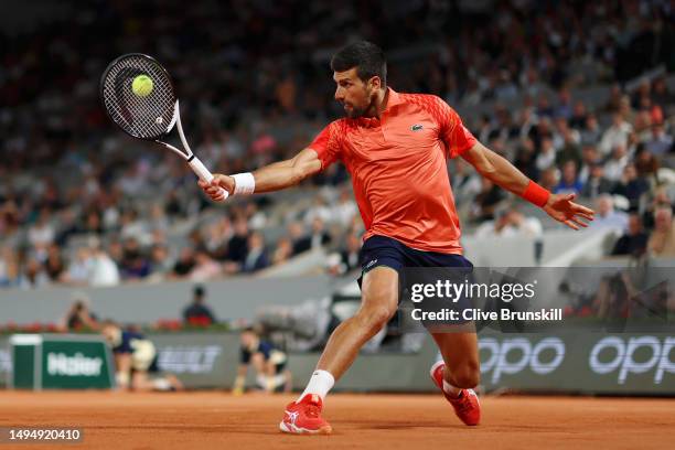 Novak Djokovic of Serbia plays a backhand against Marton Fucsovics of Hungary during the Men's Singles Second Round Match on Day Four of the 2023...