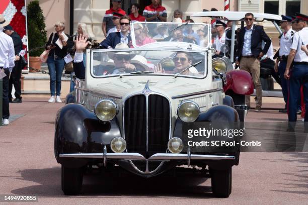 Princess Charlene of Monaco and Prince Albert II of Monaco along with other members of the royal family parade in vintage cars as part of the...