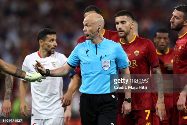 Players of AS Roma confront Referee Anthony Taylor during the UEFA Europa League 2022/23 final match between Sevilla FC and AS Roma at Puskas Arena...