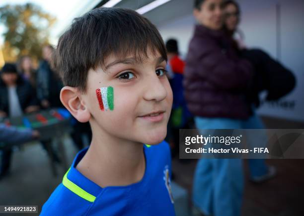 Boy with his cheek painted with Italian national flag is seen prior to the FIFA U-20 World Cup Argentina 2023 Round of 16 match between England and...