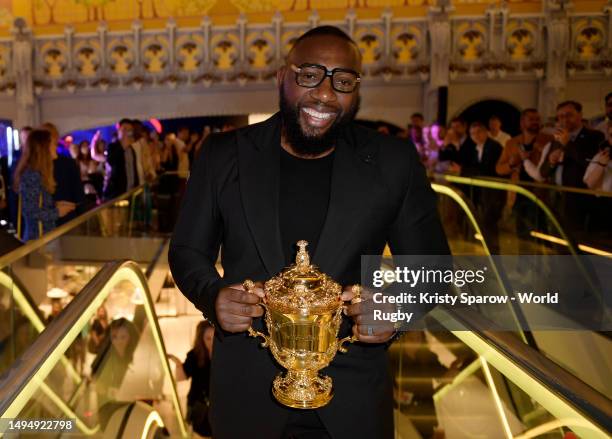 Tendai Mtawarira holds the Webb Ellis Cup during an event to mark the 100-day countdown to the start of Rugby World Cup France 2023 on May 31, 2023...