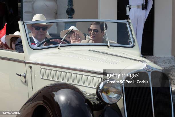 Princess Charlene of Monaco and Prince Albert II of Monaco along with other members of the royal family parade in vintage cars as part of the...