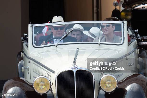 Princess Charlene of Monaco and Prince Albert II of Monaco along with other members of the royal family parade in vintage cars as part of the...