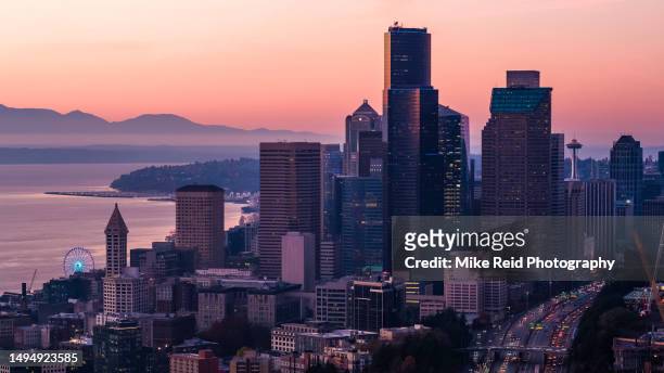 downtown seattle dusk light with a peek at the space needle - seattle ferry stock pictures, royalty-free photos & images