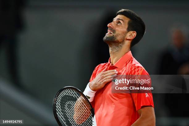 Novak Djokovic of Serbia celebrates winning match point against Marton Fucsovics of Hungary during the Men's Singles Second Round Match on Day Four...