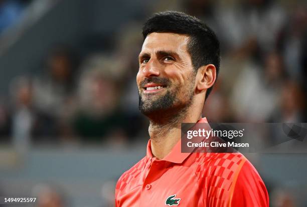 Novak Djokovic of Serbia celebrates winning match point against Marton Fucsovics of Hungary during the Men's Singles Second Round Match on Day Four...