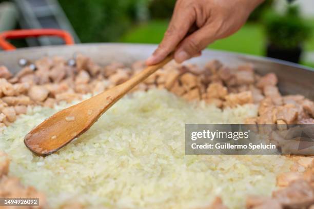 Paella Rice Adding 2,593 Paella Rice Stock Photos, High-Res Pictures, and Images - Getty ...