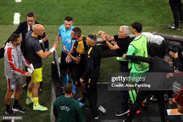 Jose Mourinho, Head Coach of AS Roma, confronts Marko Dmitrovic of Sevilla FC during the UEFA Europa League 2022/23 final match between Sevilla FC...