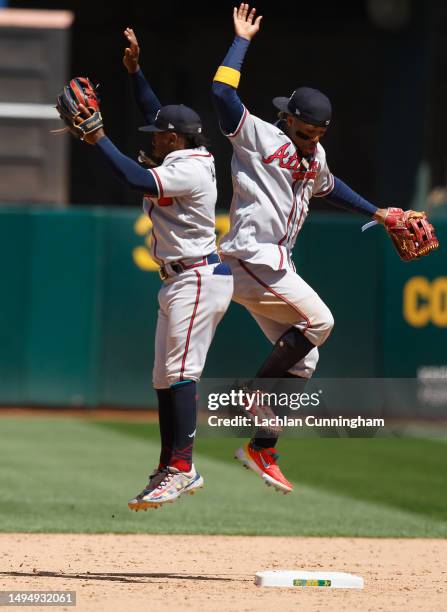 Ozzie Albies and Ronald Acuna Jr. #13 of the Atlanta Braves celebrate after a win against the Oakland Athletics at RingCentral Coliseum on May 31,...