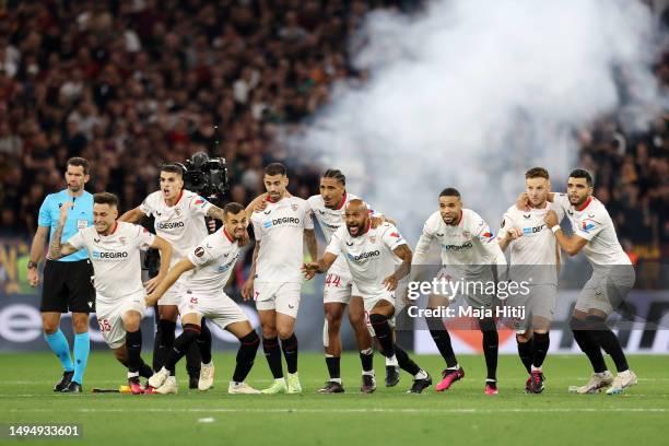 Players of Sevilla FC celebrate after Gonzalo Montiel of Sevilla FC scores the team's fourth penalty in the penalty shoot out during the UEFA Europa...