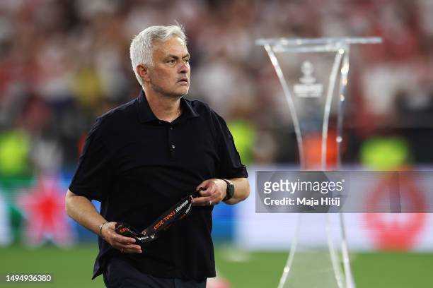 Jose Mourinho, Head Coach of AS Roma, removes their runners up medal after collecting it from Aleksander Ceferin, President of UEFA, after defeat to...