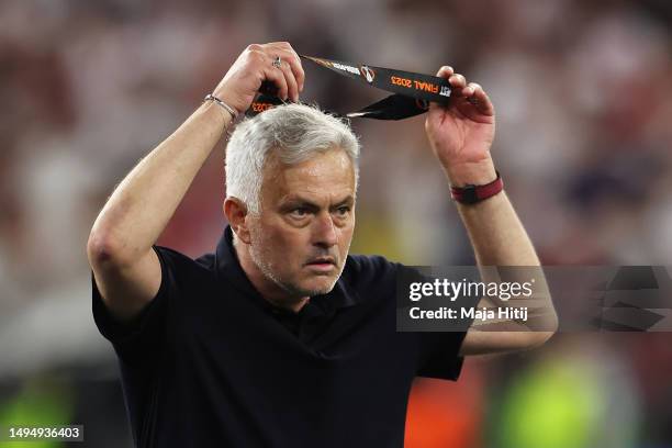 Jose Mourinho, Head Coach of AS Roma, removes their runners up medal after collecting it from Aleksander Ceferin, President of UEFA, after defeat to...