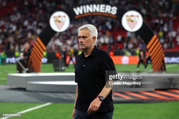 Jose Mourinho, Head Coach of AS Roma, looks dejected as they carry their runners up medal after removing it following the team's defeat in the...