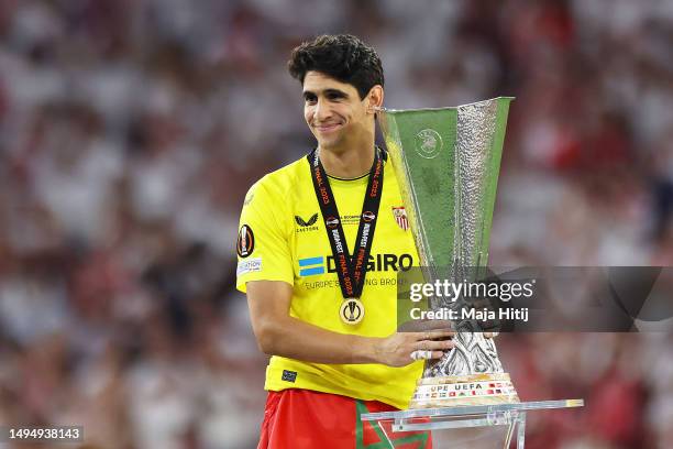 Yassine Bounou of Sevilla FC celebrates with the UEFA Europa League trophy after the team's victory during the UEFA Europa League 2022/23 final match...