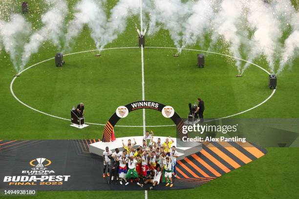 Ivan Rakitic of Sevilla FC lifts the UEFA Europa League trophy after the team's victory during the UEFA Europa League 2022/23 final match between...