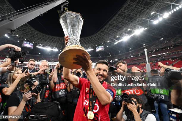 Jesus Navas of Sevilla FC celebrates with the UEFA Europa League trophy after the team's victory during the UEFA Europa League 2022/23 final match...