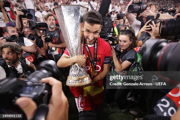 Jesus Navas of Sevilla FC celebrates with the UEFA Europa League trophy after the team's victory during the UEFA Europa League 2022/23 final match...