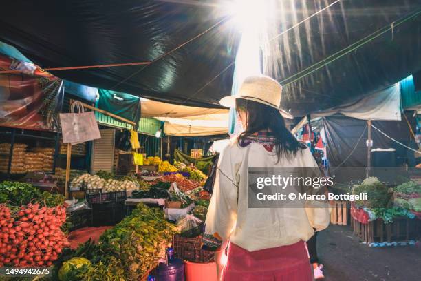 woman shopping in a street market - street market stock pictures, royalty-free photos & images