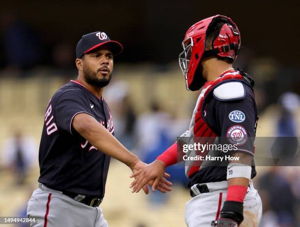 Jeimer Candelario and Keibert Ruiz of the Washington Nationals celebrate a 10-6 win over the Los Angeles Dodgers at Dodger Stadium on May 31, 2023 in...