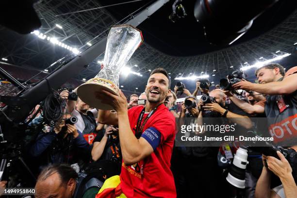 Jesus Navas of Sevilla celebrates with the trophy during the UEFA Europa League 2022/23 final match between Sevilla FC and AS Roma at Puskas Arena on...