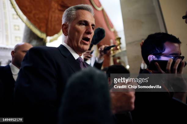 Speaker of the House Kevin McCarthy talks to reporters as he heads for the final vote on the Fiscal Responsibility Act of 2023 at the U.S. Capitol on...