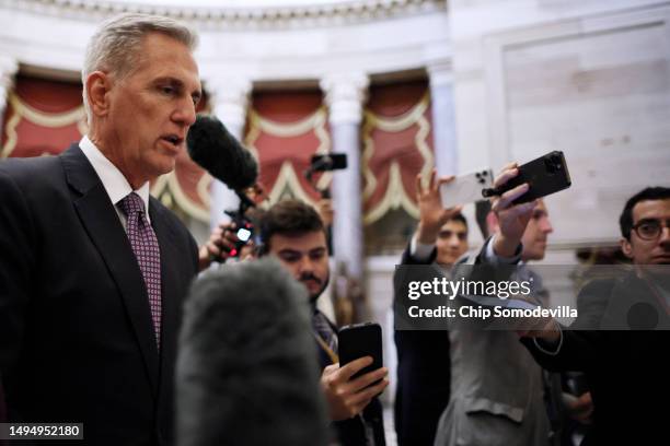 Speaker of the House Kevin McCarthy talks to reporters as he heads for the final vote on the Fiscal Responsibility Act of 2023 at the U.S. Capitol on...