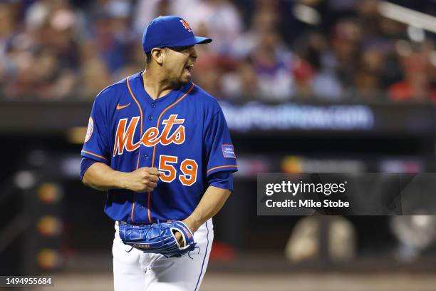 Carlos Carrasco of the New York Mets reacts after Bryson Stott of the Philadelphia Phillies grounds out to shortstop to end the top of the fifth...