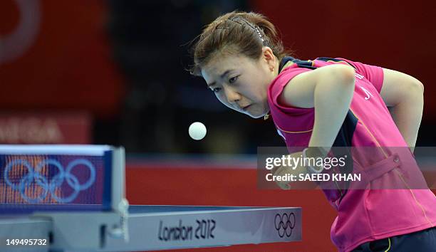 Ai Fukuhara of Japan returns a shot to Anna Tikhomirova of Russia during a table tennis women's singles round match of the London 2012 Olympic Games...