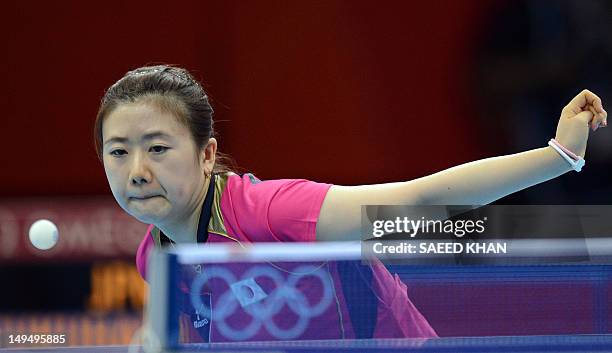 Ai Fukuhara of Japan returns a shot to Anna Tikhomirova of Russia during a table tennis women's singles round match of the London 2012 Olympic Games...