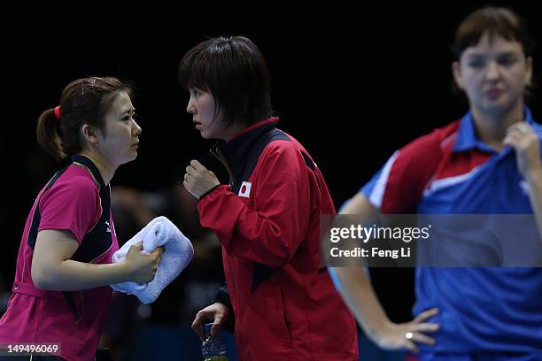 Ai Fukuhara of Japan speaks to the Japan team coach in her Women's Singles Table Tennis third round match against Anna Tikhomirova of Russia on Day 2...