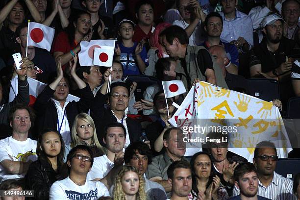 Fans watch the Women's Singles Table Tennis third round match between Ai Fukuhara of Japan and Anna Tikhomirova of Russia on Day 2 of the London 2012...