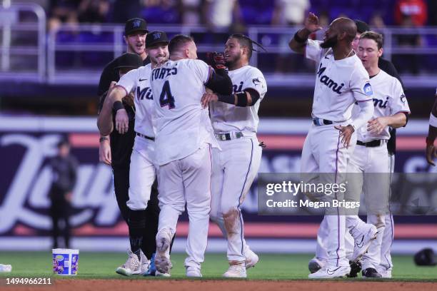 Nick Fortes of the Miami Marlins celebrates with teammates after walking it off to defeat the San Diego Padres at loanDepot park on May 31, 2023 in...