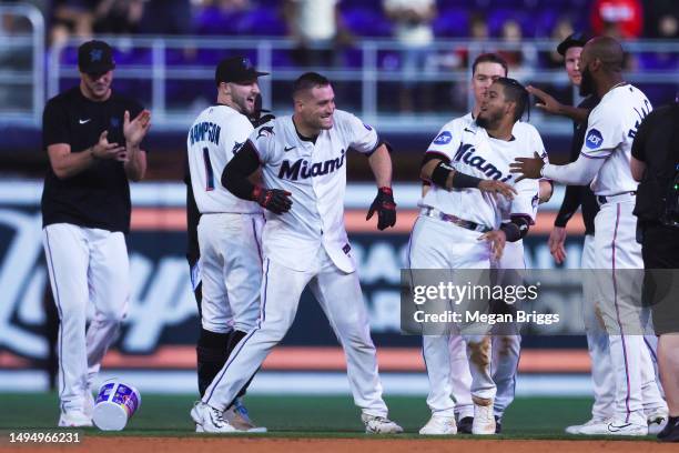 Nick Fortes of the Miami Marlins celebrates with teammates after walking it off to defeat the San Diego Padres at loanDepot park on May 31, 2023 in...