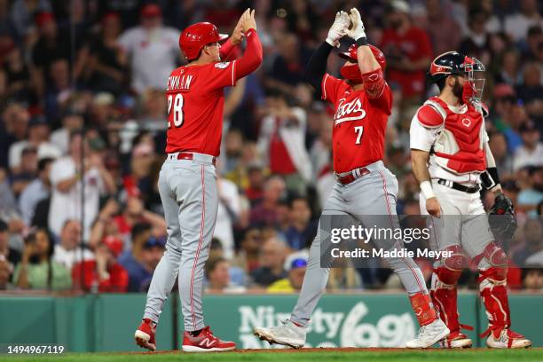 Spencer Steer of the Cincinnati Reds celebrates with Kevin Newman after hitting a two run home run against the Boston Red Sox during the seventh...