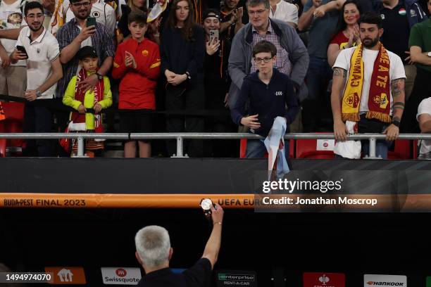 Jose Mourinho Head coach of AS Roma throws his runners' up medal to a young fan in the crowd following the UEFA Europa League 2022/23 final match...