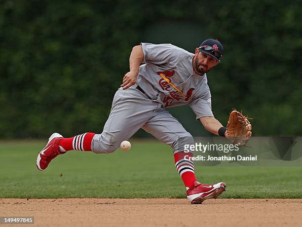 Daniel Descalso of the St. Louis Cardinals makes a play on a ball hit by Luius Valbuena of the Chicago Cubs at Wrigley Field on July 29, 2012 in...