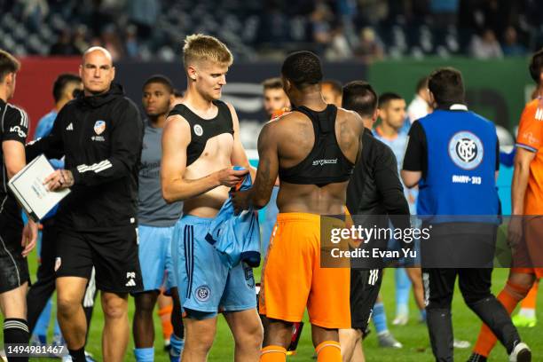 Keaton Parks of New York City Football Club and Alvas Powell of FC Cincinnati swap jerseys after the game at Yankee Stadium on May 31, 2023 in New...