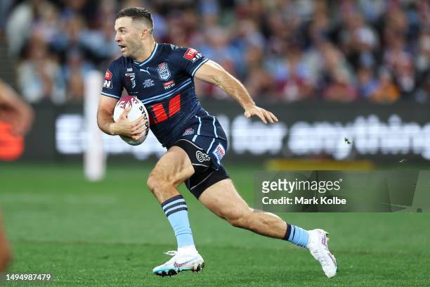 James Tedesco of the Blues runs the ball during game one of the 2023 State of Origin series between the Queensland Maroons and New South Wales Blues...