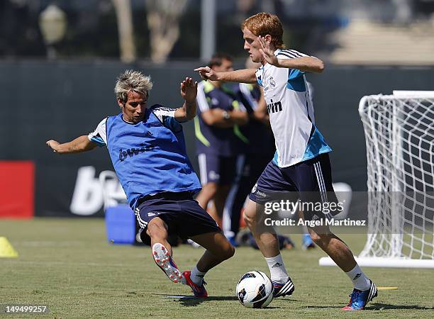 Fabio Coentrao and Alex Fernandez of Real Madrid in action during a training session at UCLA campus on July 29, 2012 in Los Angeles, California.