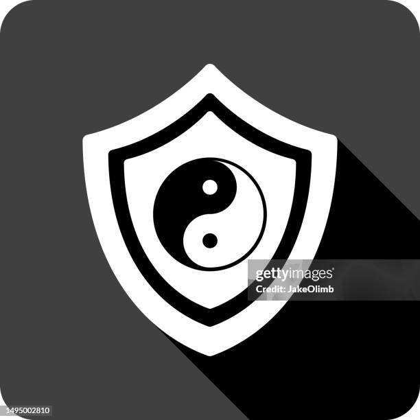 shield yin and yang icon silhouette - stress ball stock illustrations