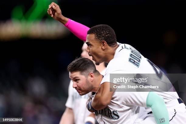 Julio Rodriguez and Ty France of the Seattle Mariners celebrate their 1-0 win against the New York Yankees during the tenth inning at T-Mobile Park...