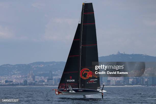 The Alinghi Red Bull Racing AC40 sails pass the Barcelona skyline during a training session on May 31, 2023 in Barcelona, Spain. The Alinghi Red Bull...