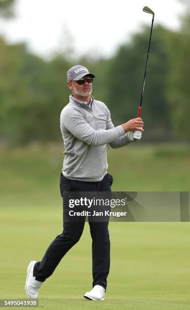 Paul Waring of England plays his second shot on the 15th hole during the first round of the Porsche European Open at Green Eagle Golf Course on June...