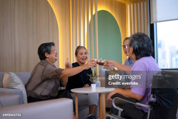 active senior meeting at coffee shop. - book club stock pictures, royalty-free photos & images