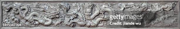 chinese dragon sculpture images - chinese dragon stock pictures, royalty-free photos & images
