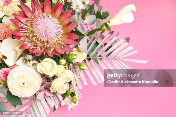 close up of bridal bouquet made of exotic tropical flowers  with pastel pink copy space. summer, spring flower composition - ranunculus wedding bouquet stock pictures, royalty-free photos & images