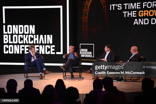 Marcin Zarakowski, Yves Mersch, Ben McKenzie and Bryan Daugherty speak onstage during 'It’s time for Regulation to Enable the Growth of Blockchain...
